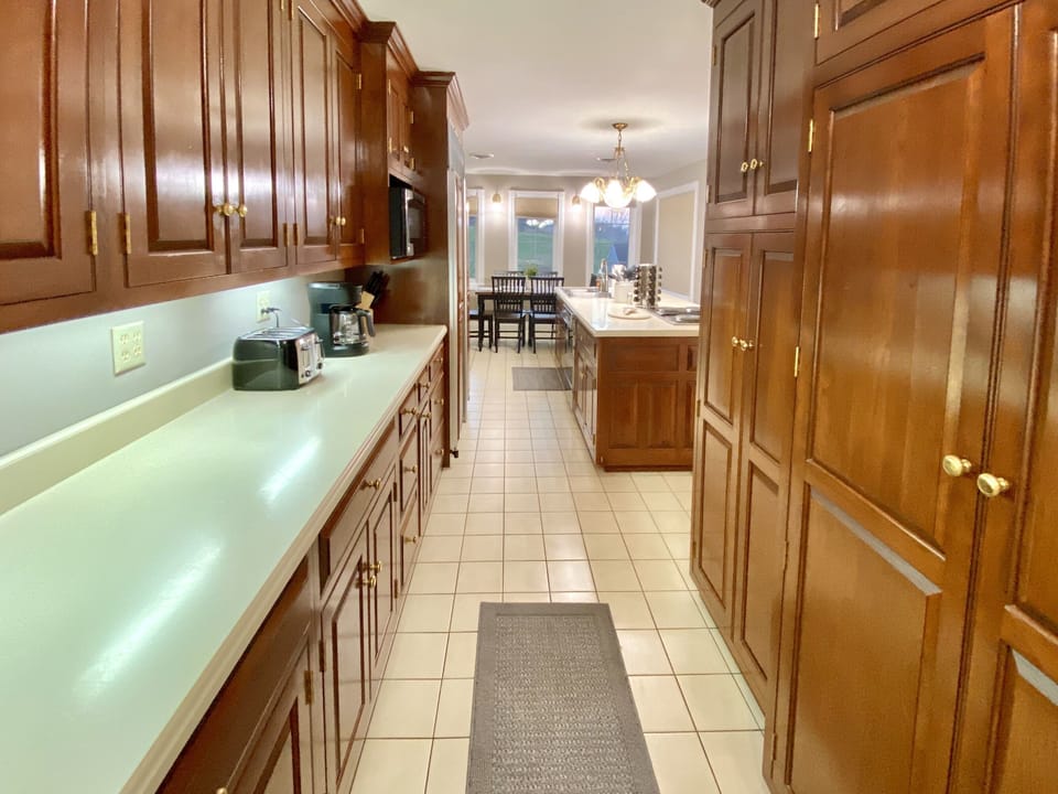 Large Kitchen with Cherry Cabinets and Sub Zero refrigerator