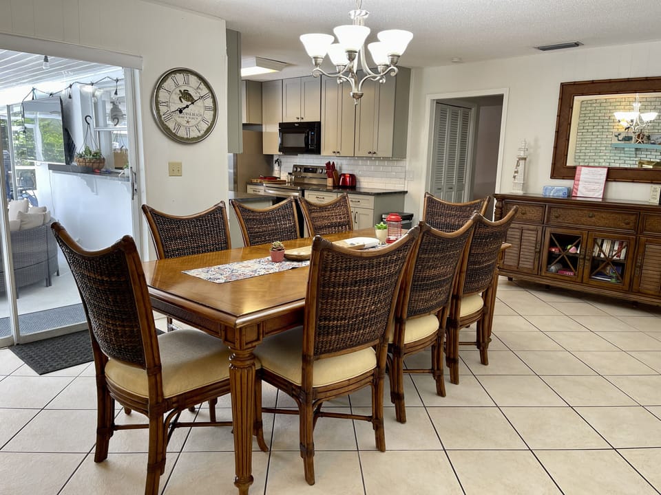 Dining room with access to kitchen and pool.