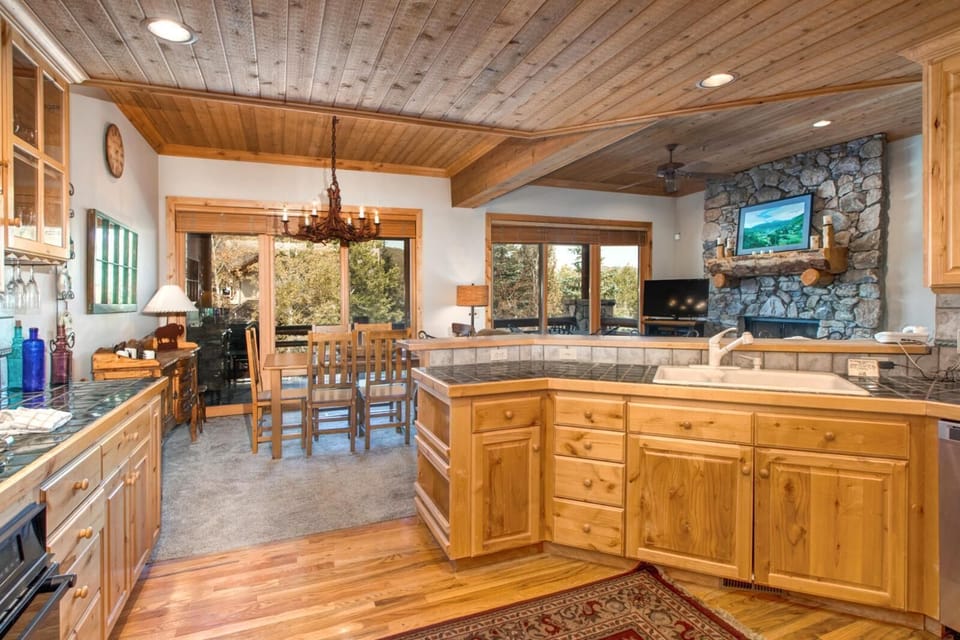 Ample counter space and bar seating make this kitchen perfect for prepping meals or chatting over breakfast before a day out.