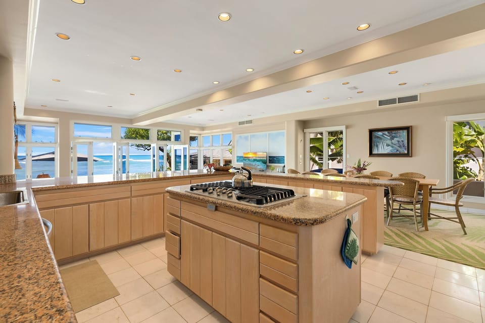 Chef-ready kitchen with ocean views and central island—cook while soaking in the scenery.
