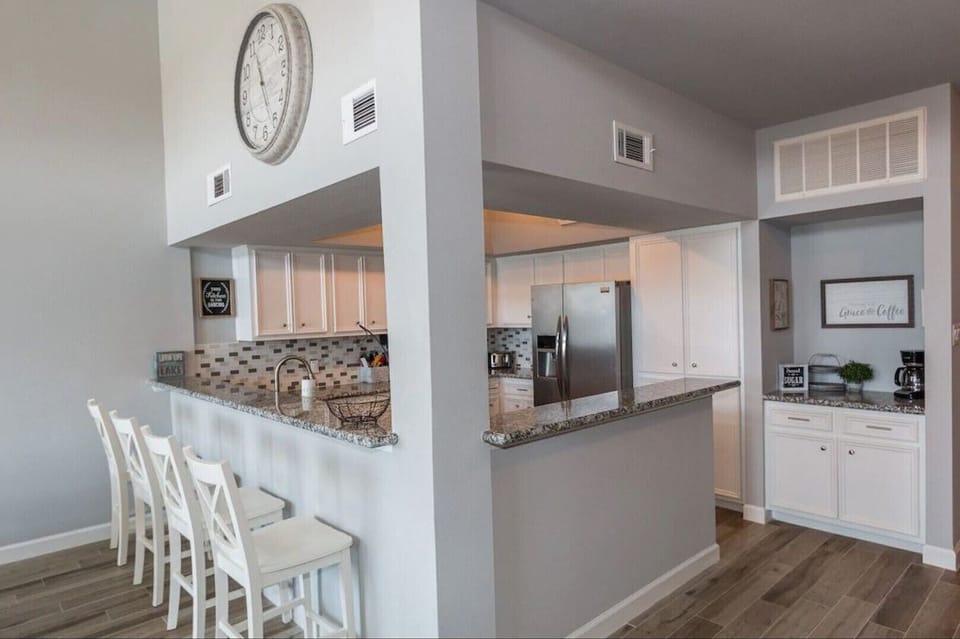 Kitchen with all cooking essentials and bar seating