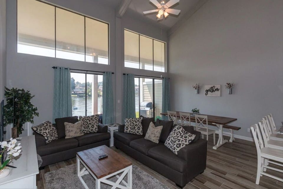 Stunning living room/dining area with beautiful views of the water!