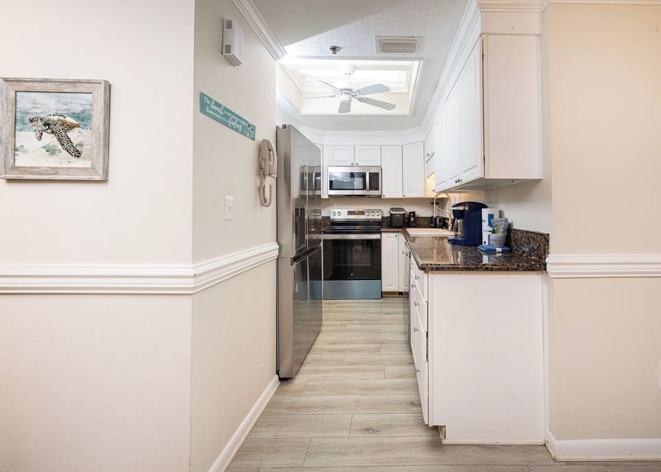 Savor your culinary creations in this bright kitchen, where family gatherings come to life with every dish shared