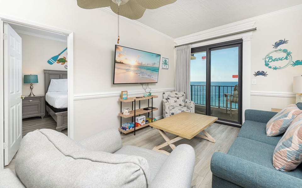 Relax after a day at the beach with a good movie in this inviting living space