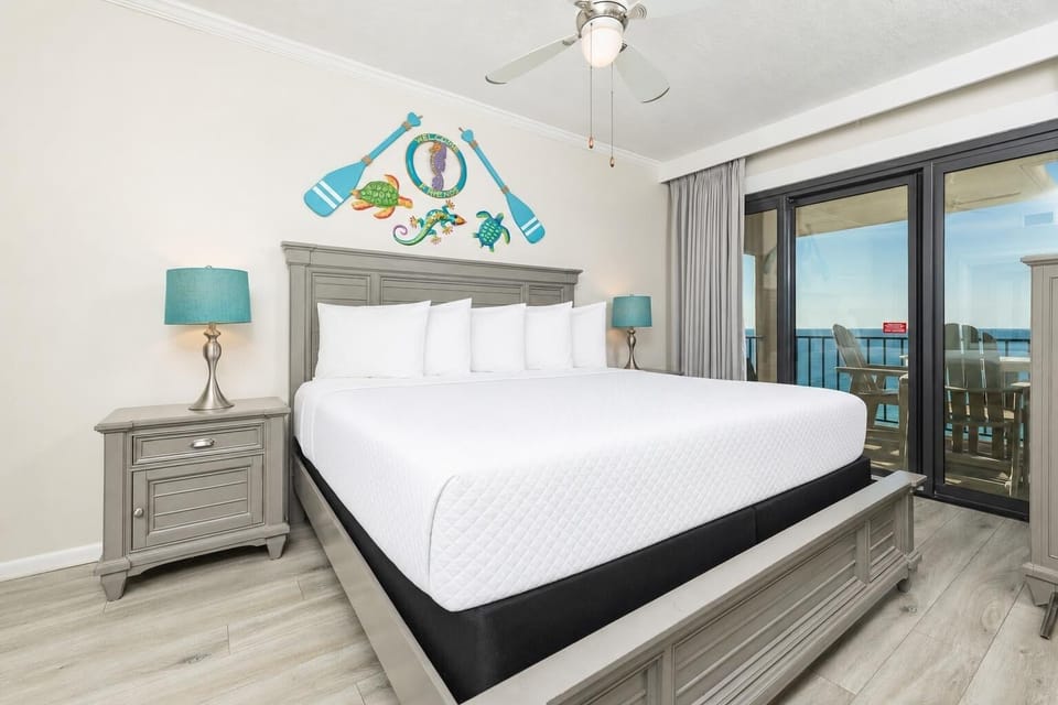Wake up refreshed in this serene master bedroom, featuring plush king bedding and a lovely view from the balcony