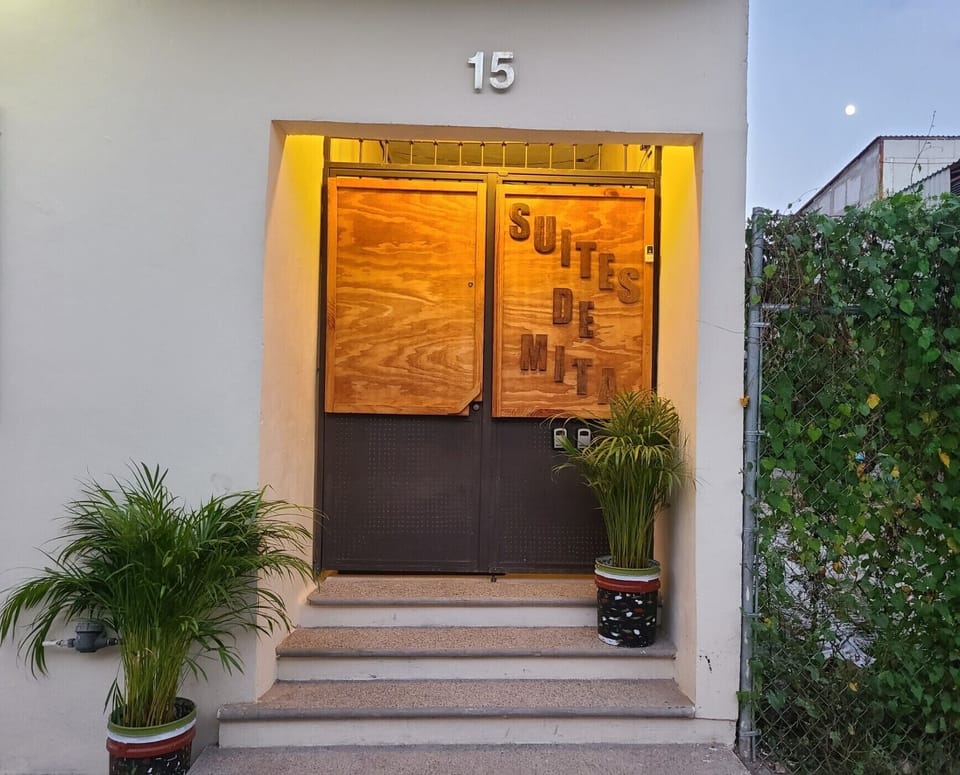 Entrance door with key lock boxes, security camera & door bell.