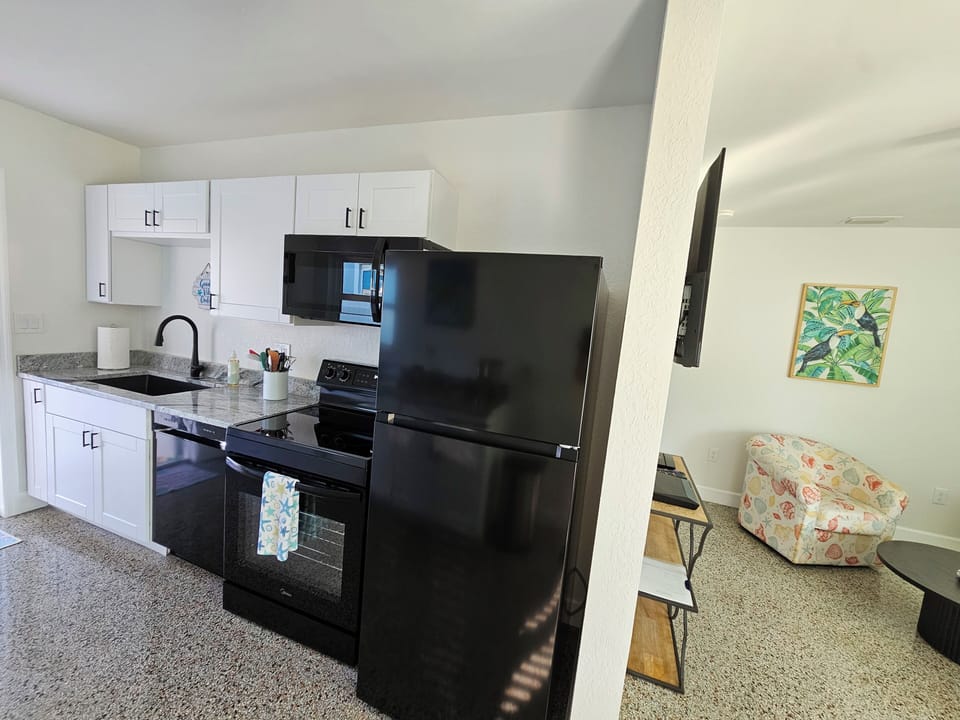 Brand new refrigerator with ice maker and full sz stove with glass cooktop