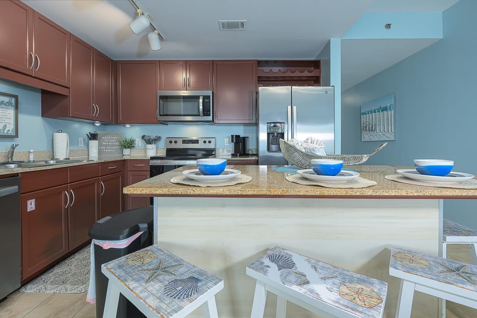 The eat-in kitchen with large island is stocked with the basics!