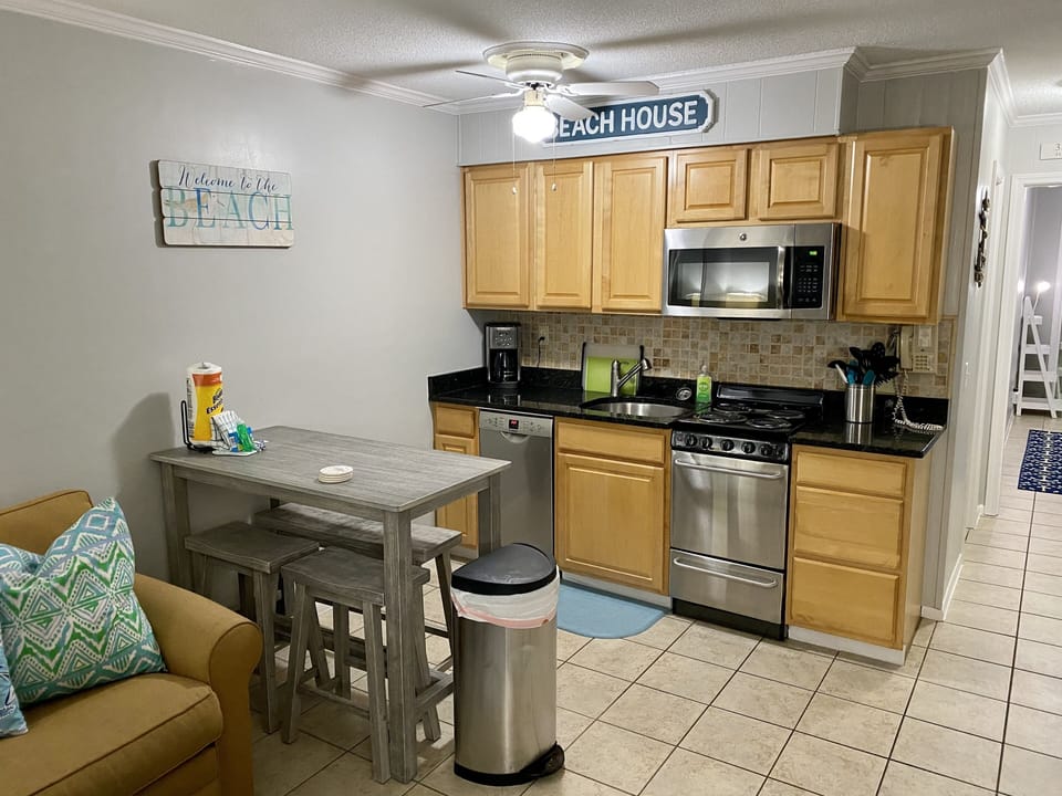 Well stocked kitchen with stainless appliances