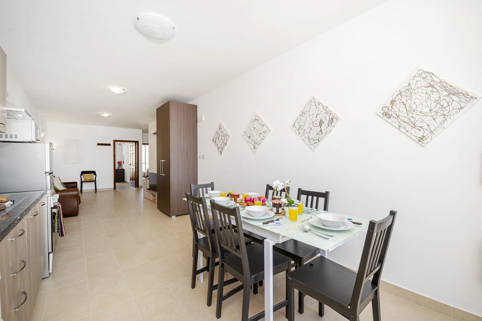 Fully equipped kitchen and dining area with panoramic views