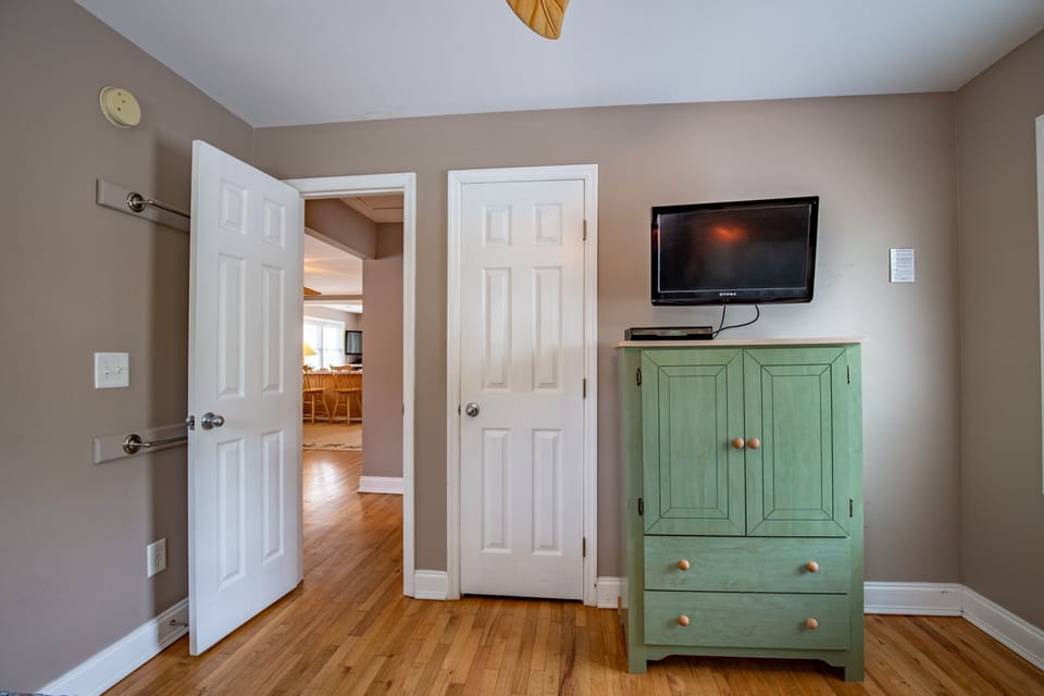 Upstairs guest room 2 with double beds has a flat screen tv