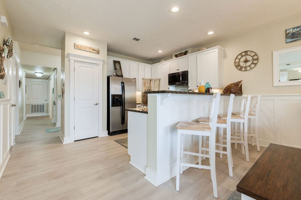 Plenty of seating at the breakfast bar to enjoy chatting with those in the kitchen