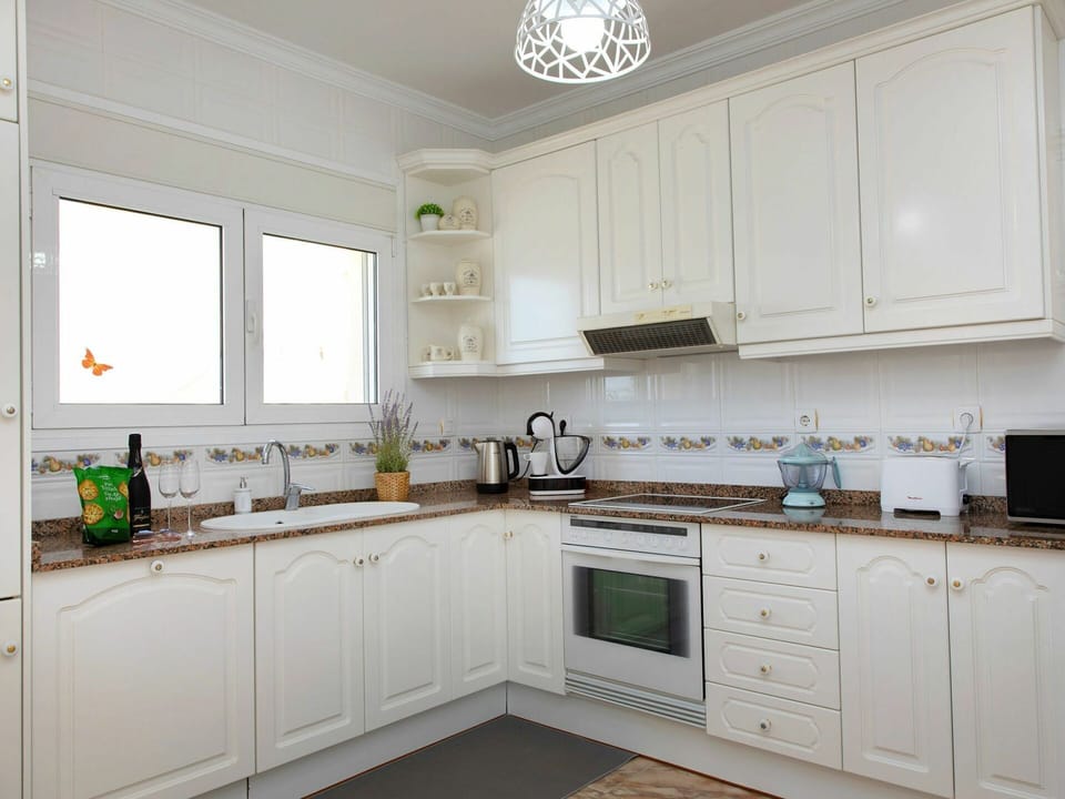Cabinetry, Countertop, Property, White, Kitchen Stove, Window, Kitchen Appliance, Sink, Home Appliance, Kitchen