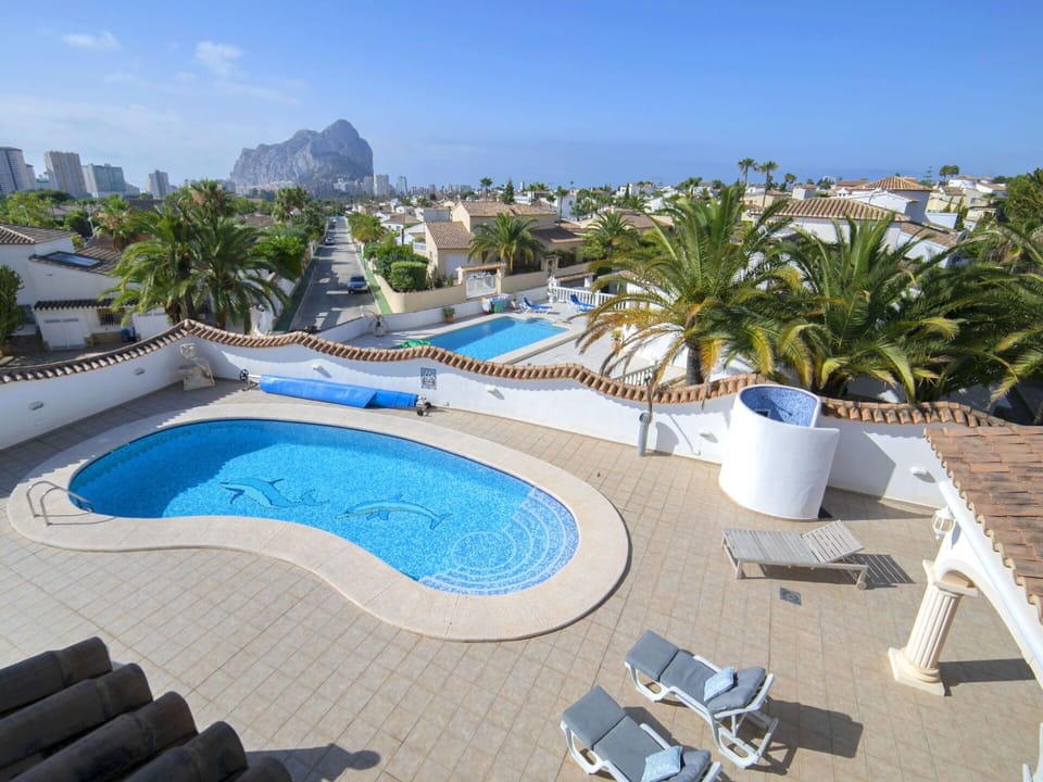 Sky, Water, Property, Swimming Pool, Seaside Resort, Azure, Tree, Outdoor Furniture, Building, Plant