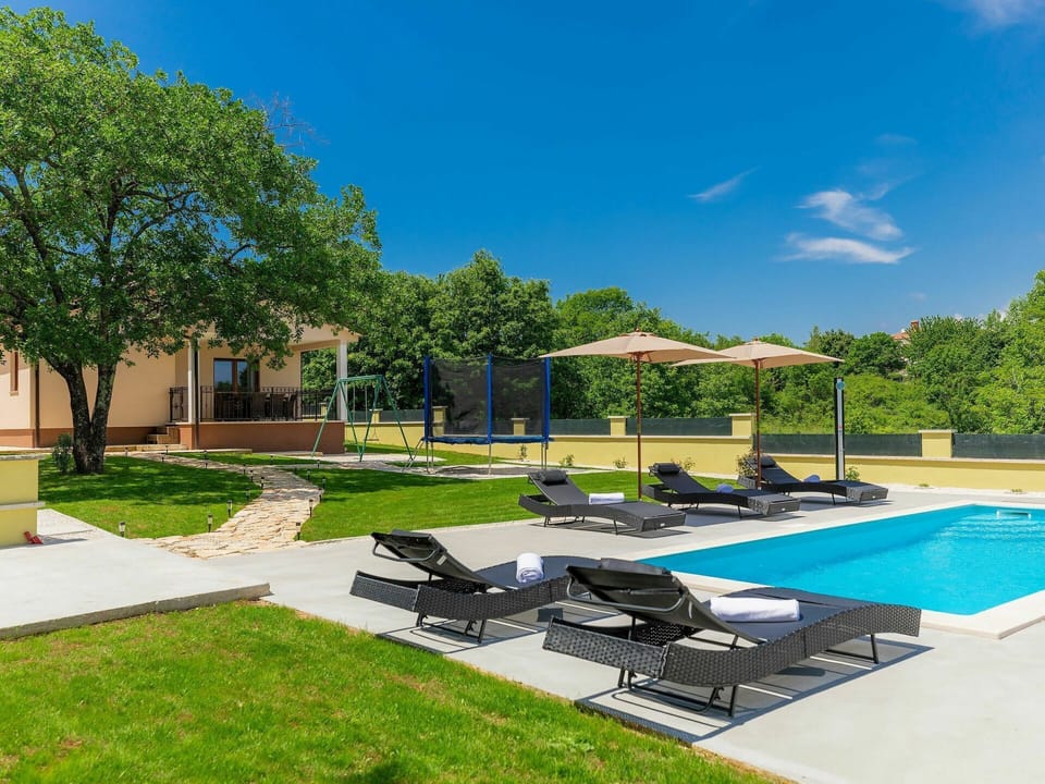 Plant, Sky, Tree, Shade, Water, Outdoor Furniture, Cloud, Building, Swimming Pool, Condominium
