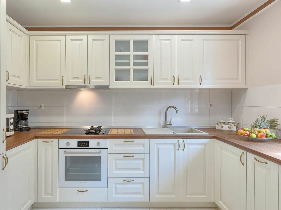 Countertop, Cabinetry, Kitchen, Furniture, Room, Property, Interior Design, Floor, Lighting, Tile