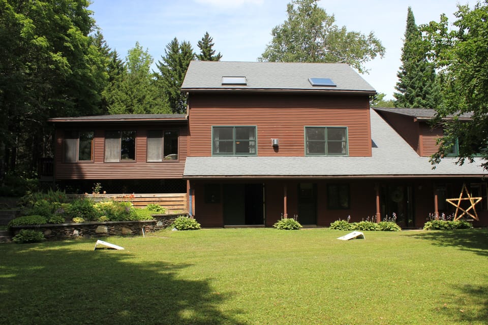 sunny front yard - lots of room for games  has a fire pit too. also big backyard