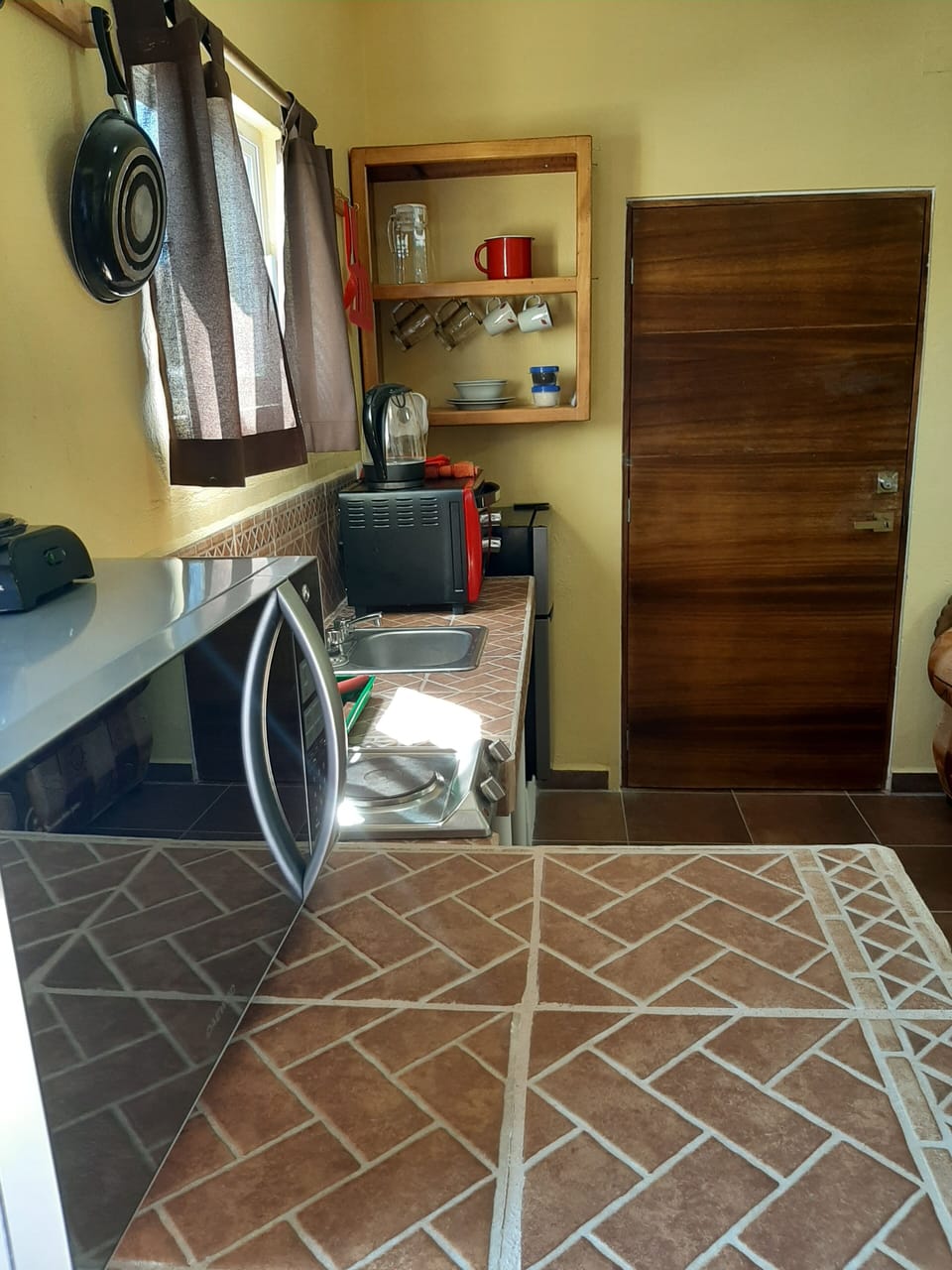 Dining bar,microwave, entrance, sink kitchen area