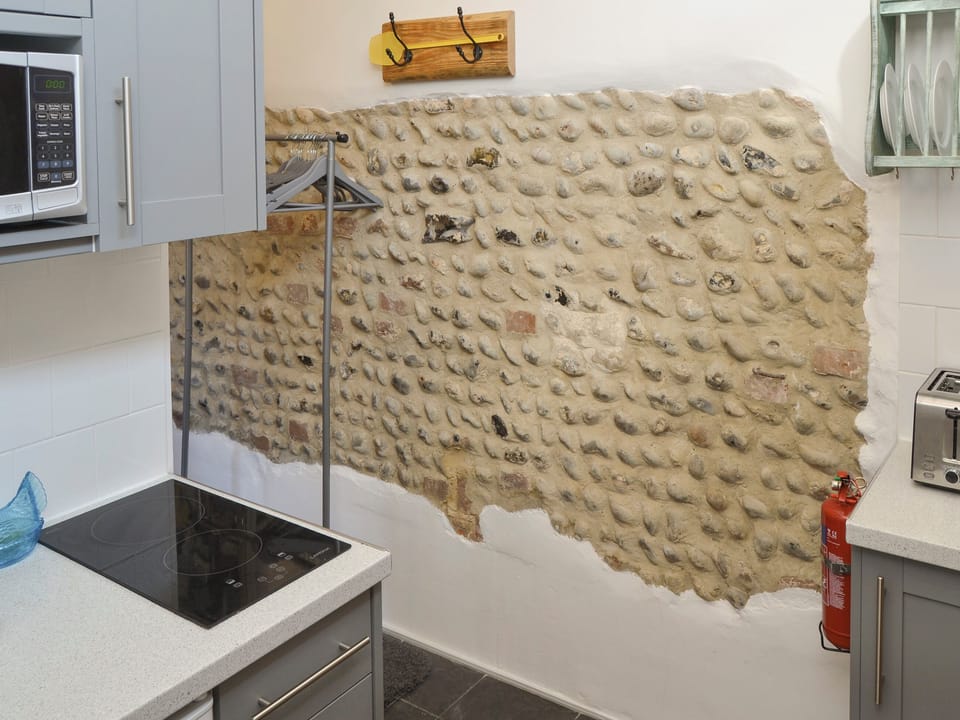 Exposed stone feature wall within kitchen area | Stone House Farm - The Old Stables - Stone House Farm , Lessingham, near Stalham