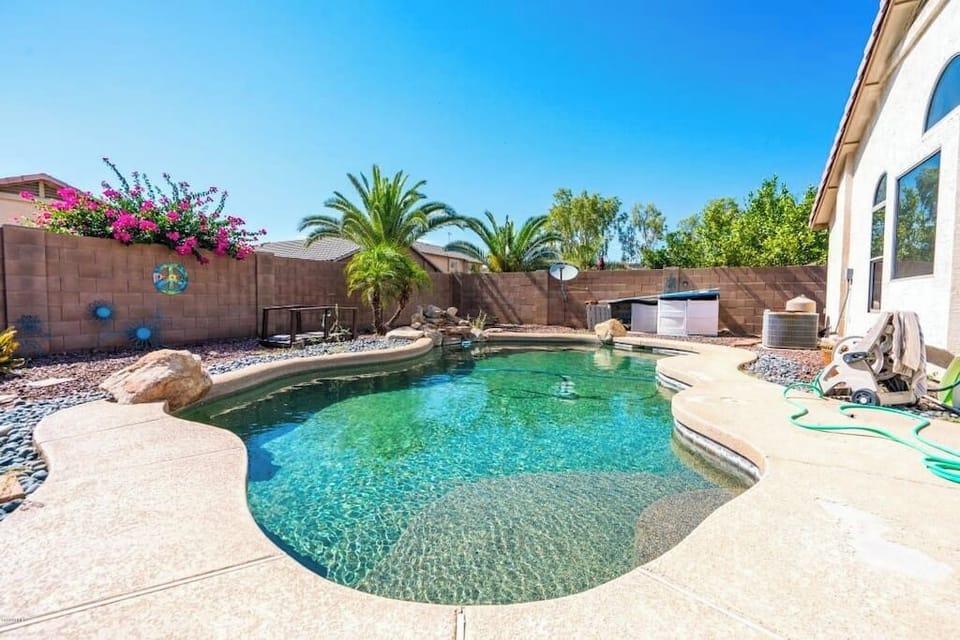 Private backyard with swimming pool, BBQ, and outdoor patio. Pool Heating optional,  fee required 