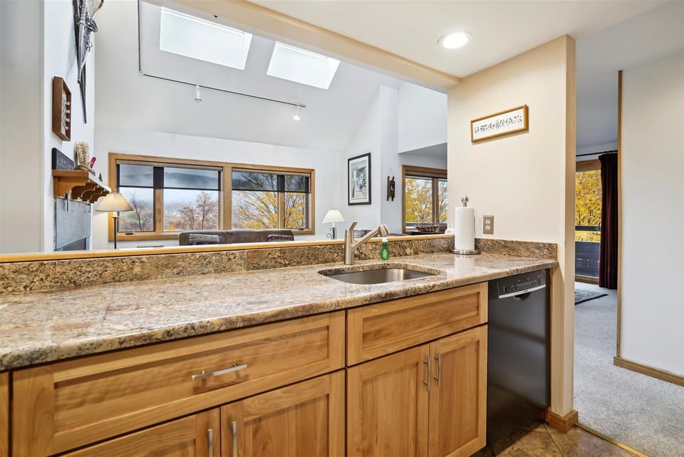 Open kitchen with views into the main living room, keeping everyone connected