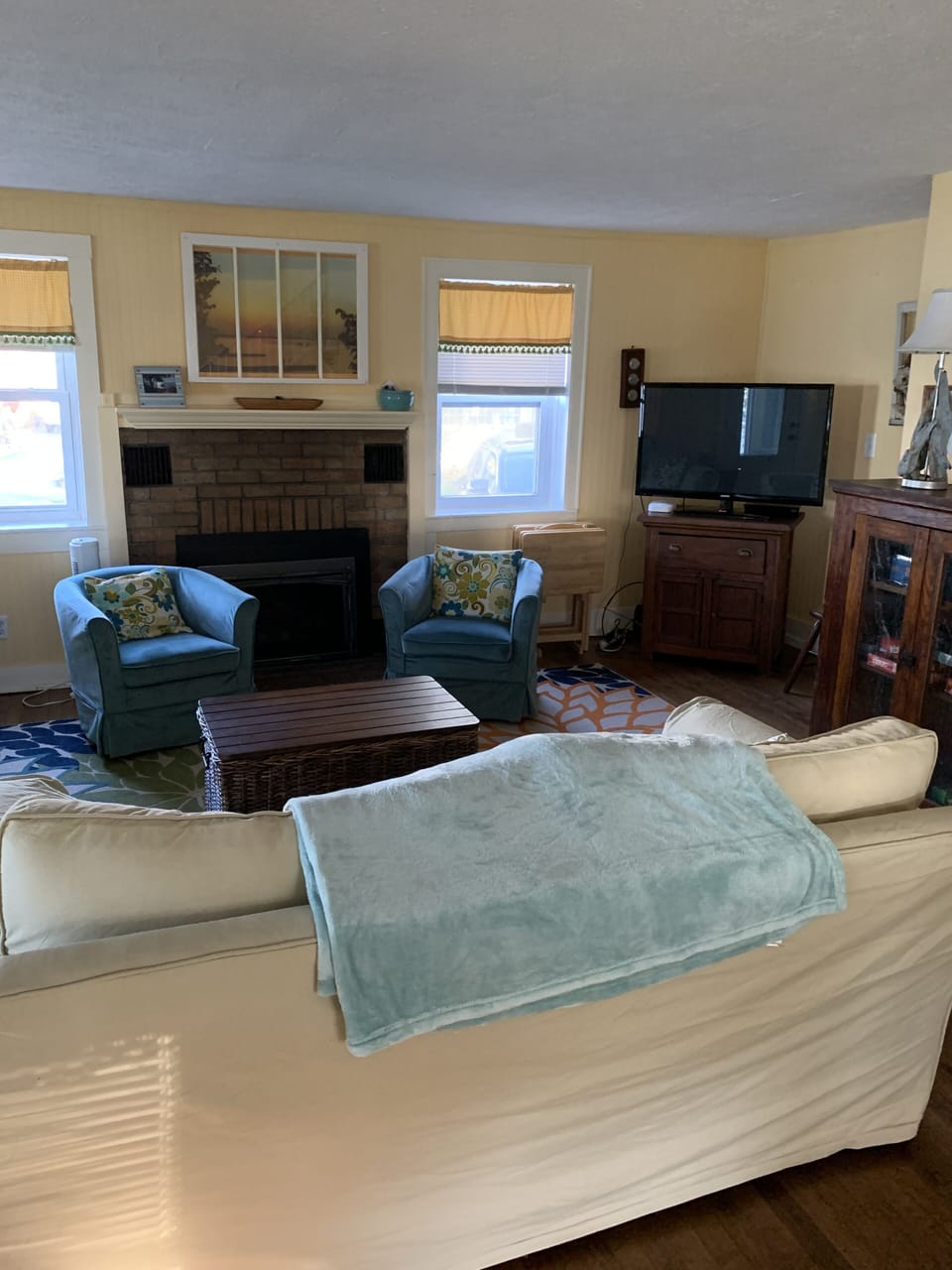 Living room with gas fireplace for cozy winter days and nights, TV