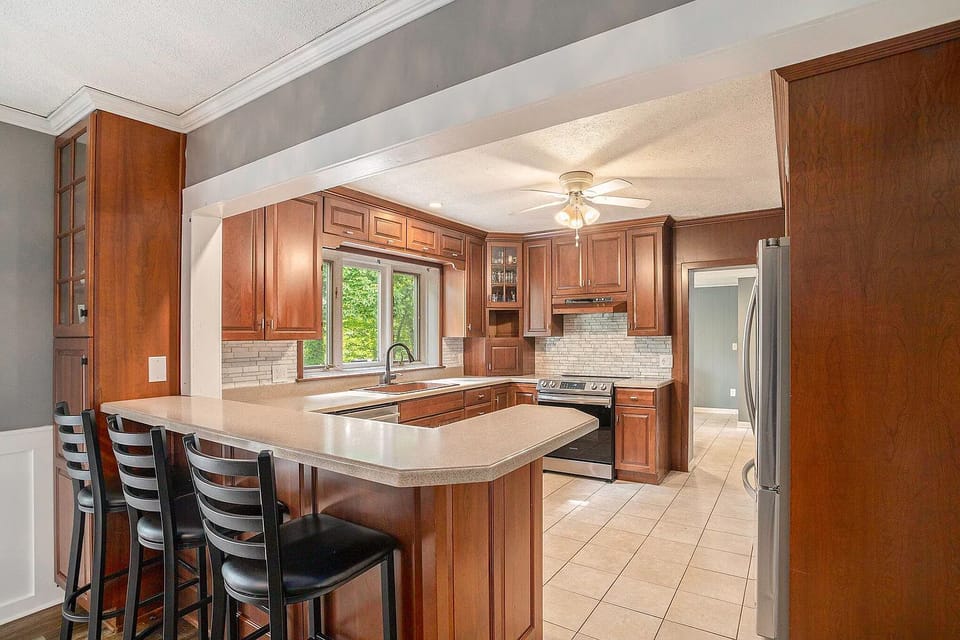 The kitchen has a large breakfast bar.