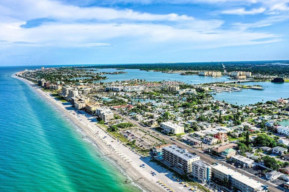 Beautiful Aerial View of the Condo, Beach, and Surrounding Area.