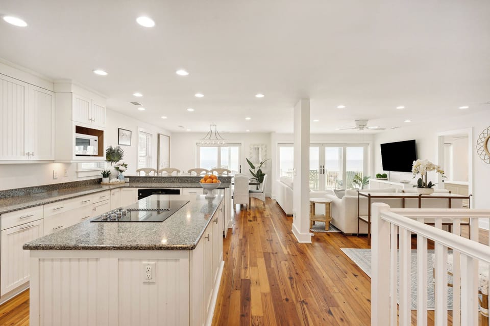 Enter Sunshine By The Sea to your bright, open concept living space