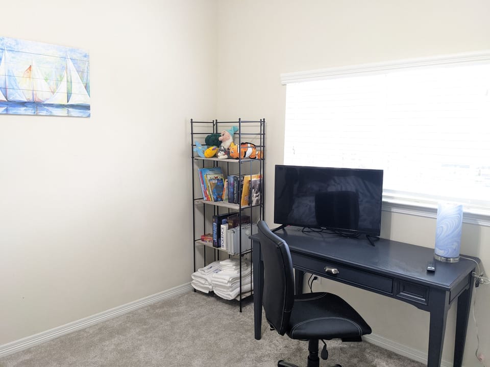 Desk, tv, games and books middle rm