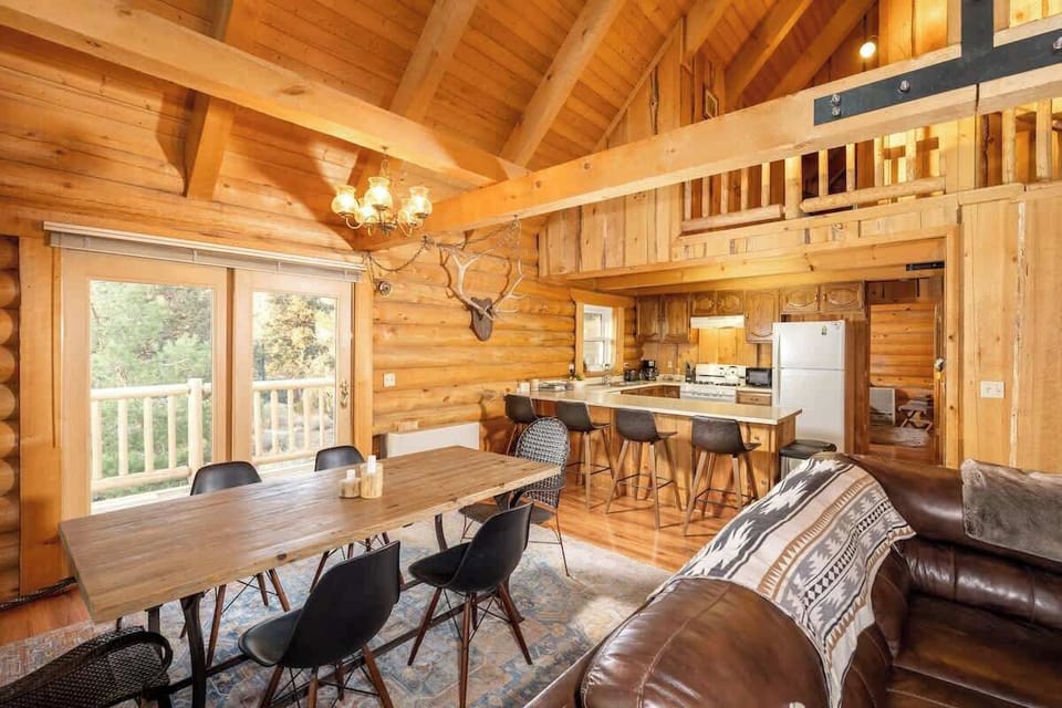 Dining table and breakfast bar on kitchen.