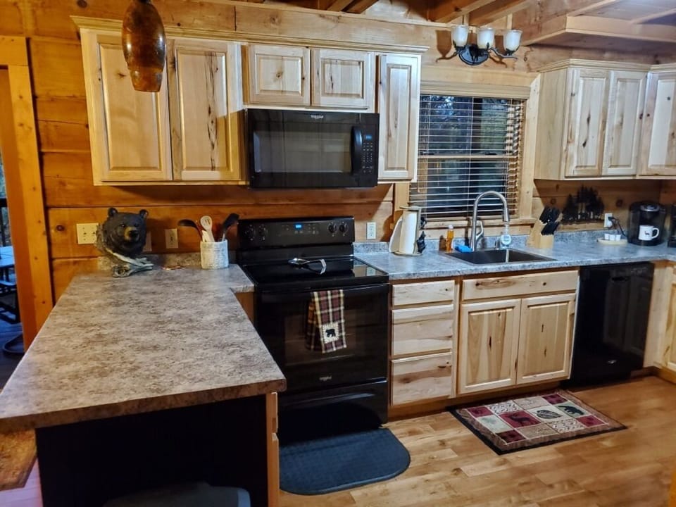 Kitchen, with all of the equipment you need to cook or enjoy some takeout!