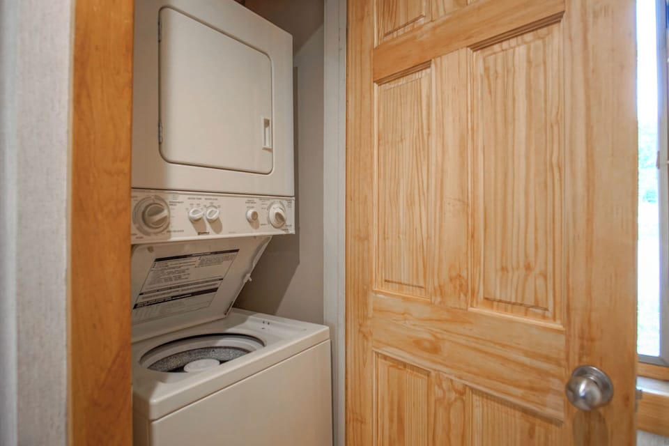 The washer and dryer are located in the kitchen.