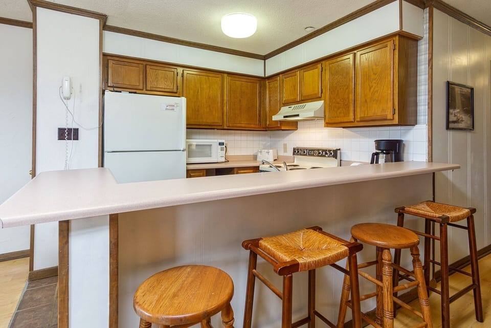 The kitchen bar seats 4.