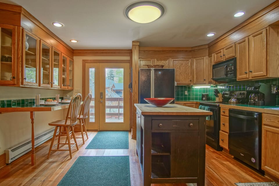 This is a picture looking at the kitchen from the dining room. You can seat 2 people at the bar.