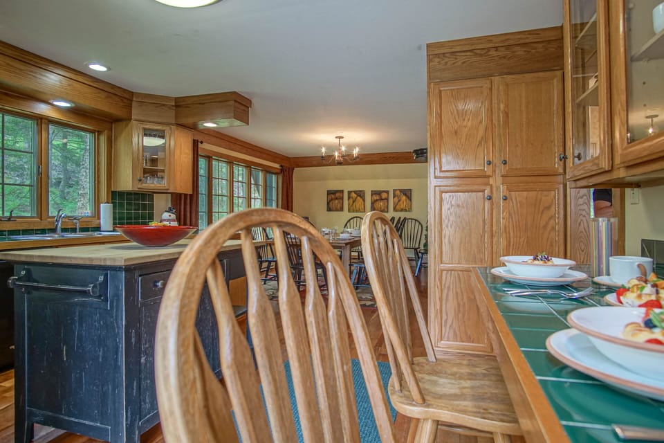 As you walk into the main entry you will see this bar with chairs and the kitchen.