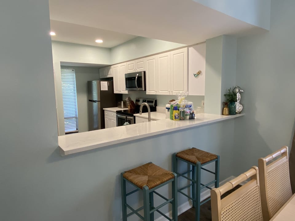 Bar stools and easy access to kitchen