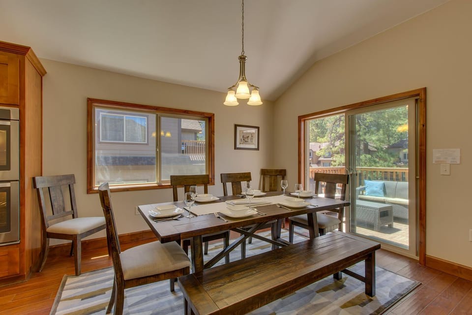 - Farmhouse dining table with seating  
- Natural light fills the open dining area  
- Patio access for outdoor dining fun