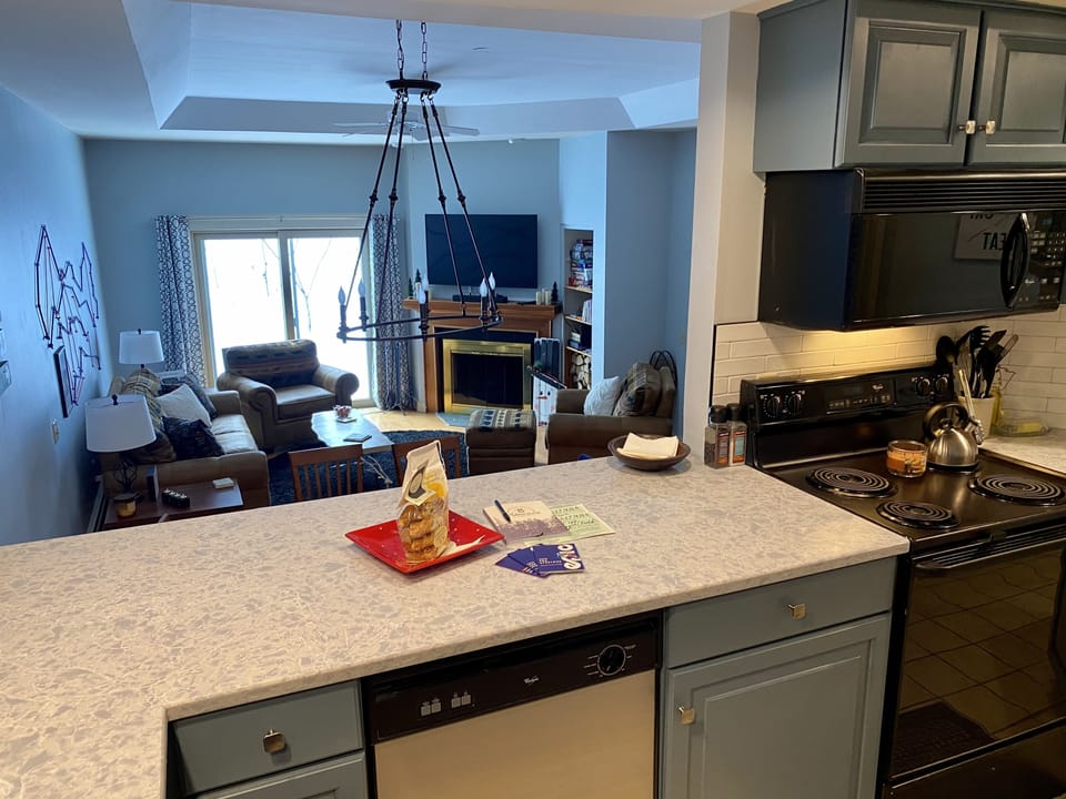 Kitchen opens to Living/Dining Area.