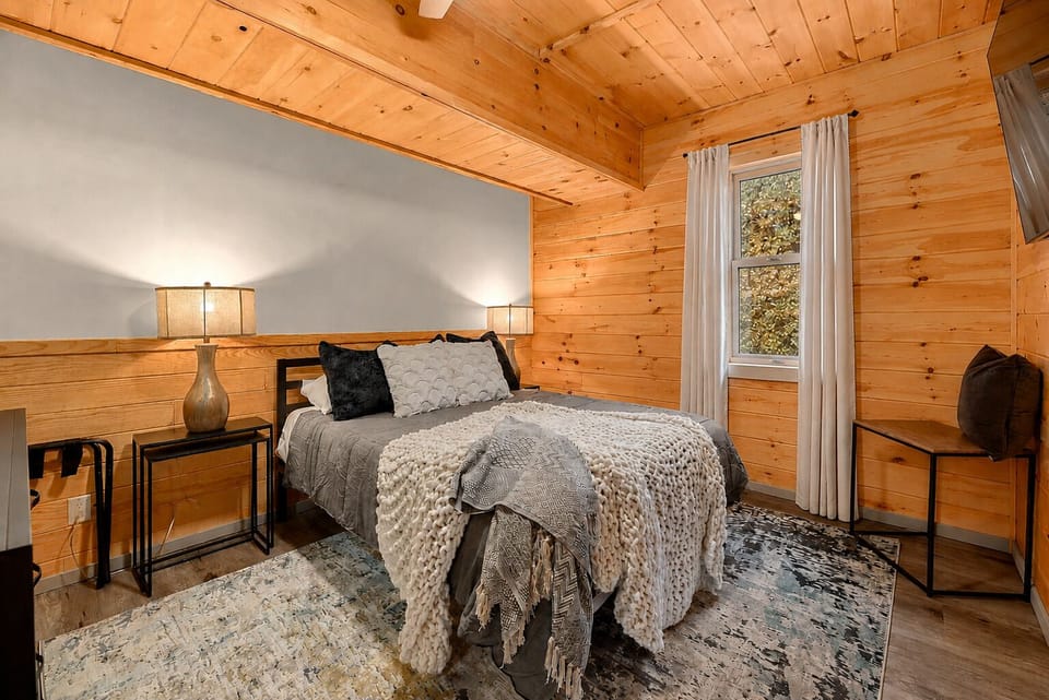 Queen bed, downstairs next to the bunk room. 