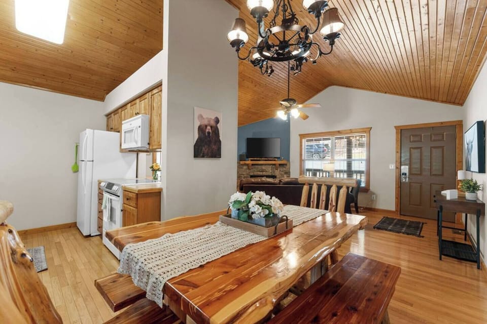 Gorgeous dining room table, chairs and bench to enjoy a meal together as a family. Located right off of the kitchen.