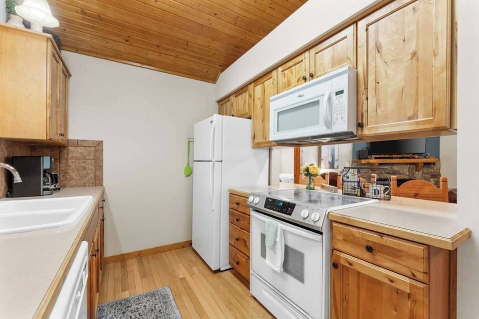 Stocked kitchen with appliances, utensils, pots and pans and everything you need to cook a meal together