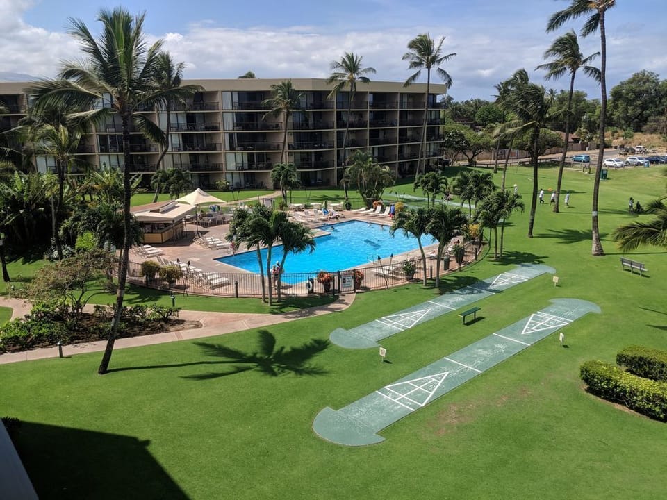 Beautiful grounds. view  of pool from lanai 