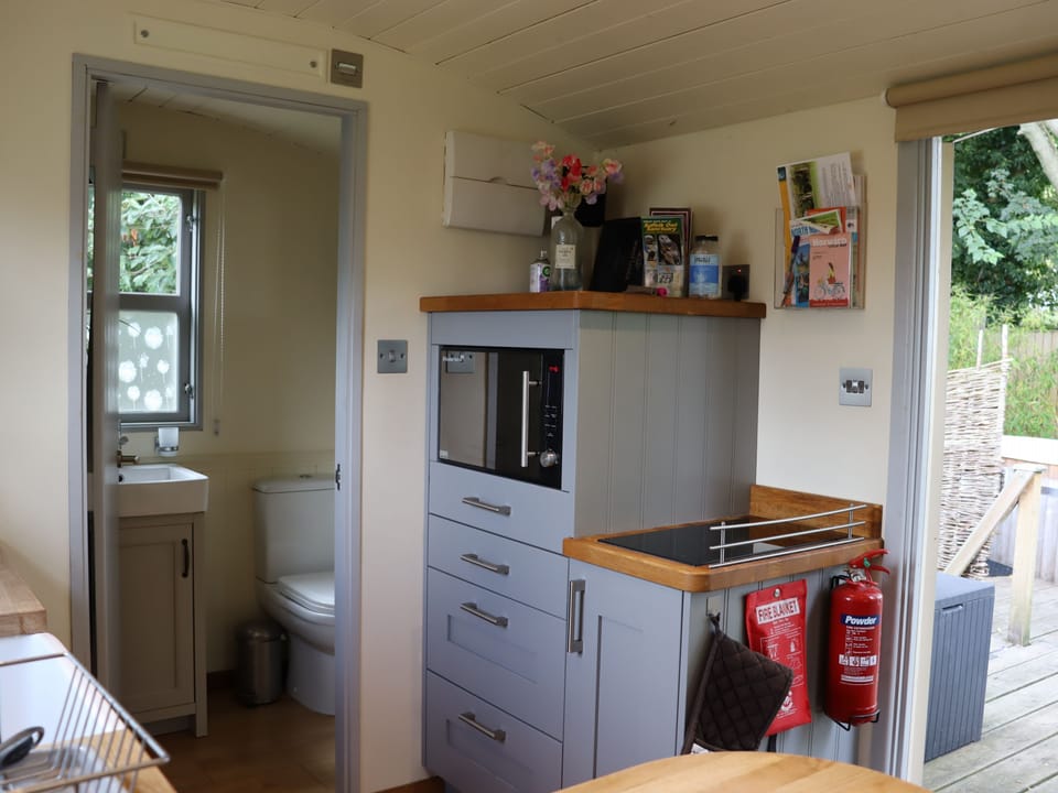 Double induction hob, combination microwave/oven/grill, kettle, toaster and fridge freezer.