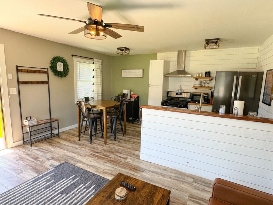 View from the couch of the dining, kitchen, and coffee bar.
