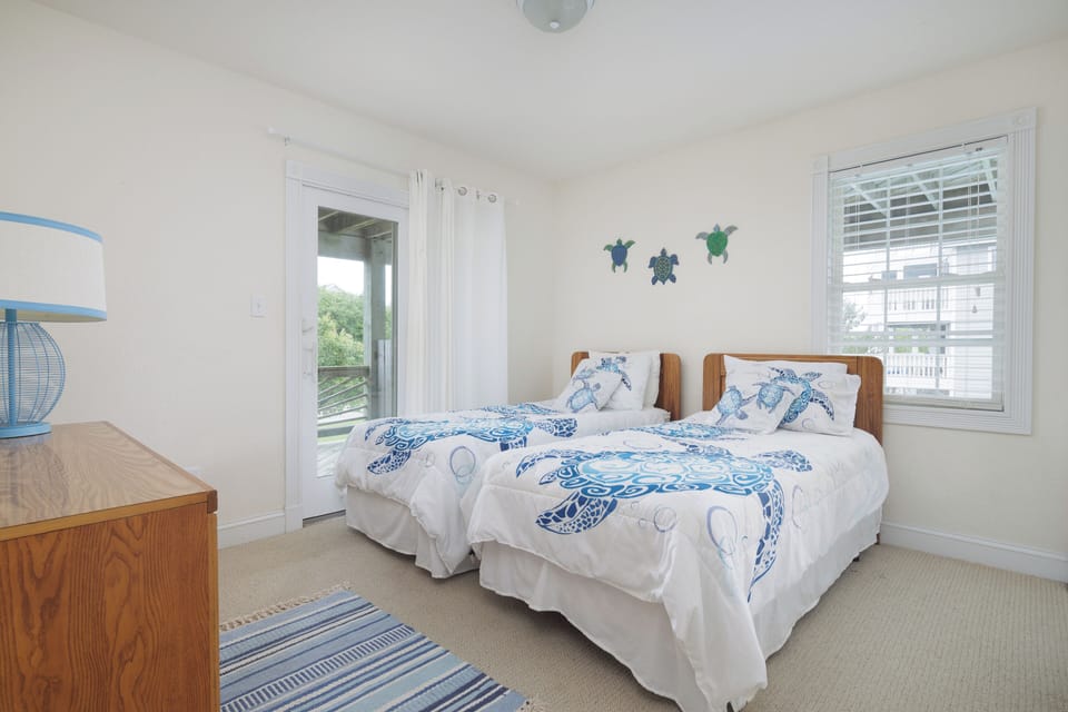 two twin beds on middle floor