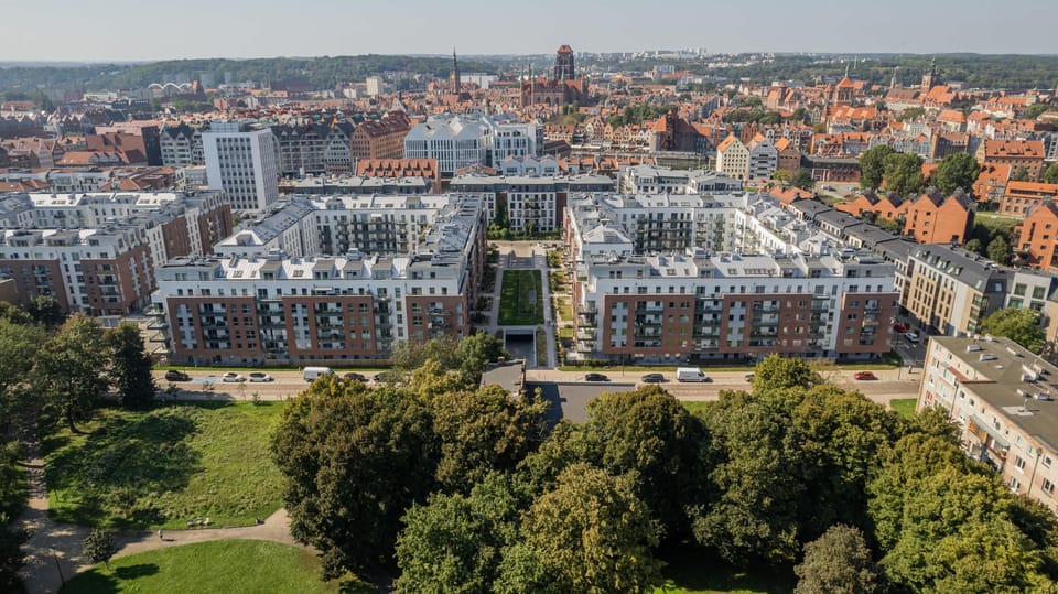 An aerial view of the building complex, showing the layout of the surrounding structures and green spaces.