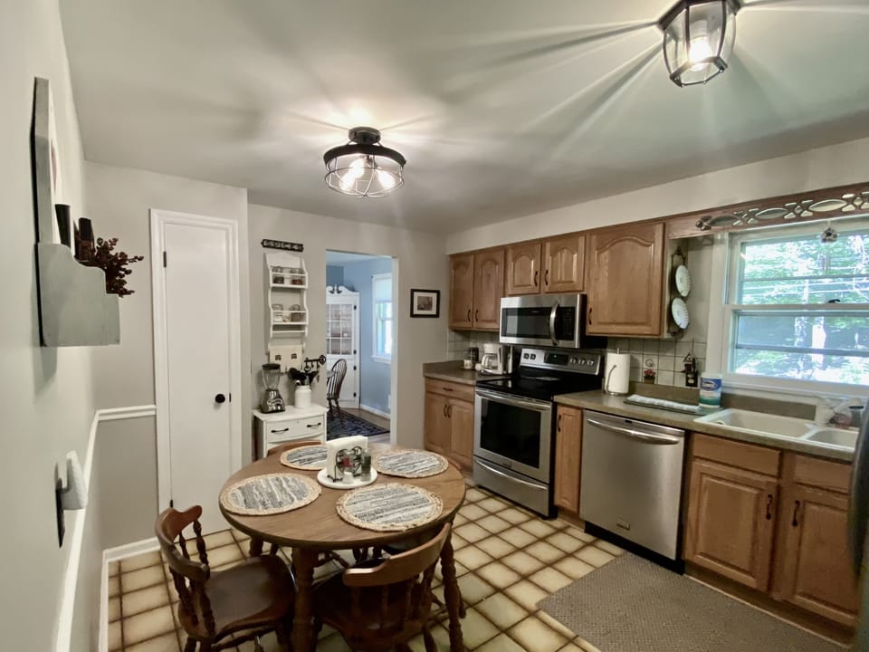 Fully equipped kitchen with stainless steel appliances. 