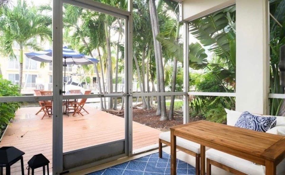 Private patio overlooking a serene waterfront canal