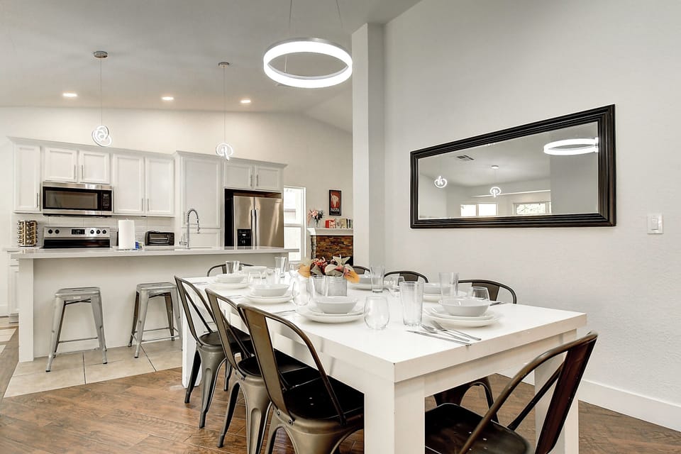 Modern kitchen with seating for 16 inside and another 12 under the patio.